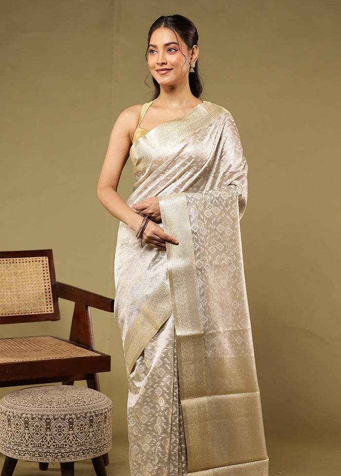 Cream Tissue Silk Saree With Blouse Piece