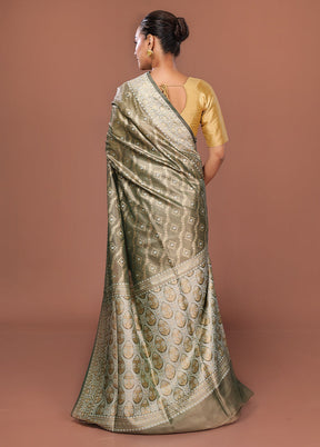 Green Tissue Silk Saree With Blouse Piece